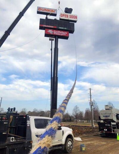 Raising components on Love's Travel Stop sign